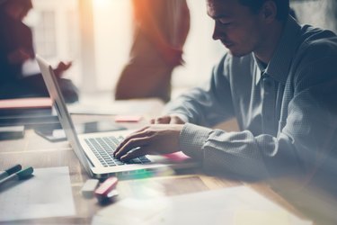 Man working with laptop. Modern office