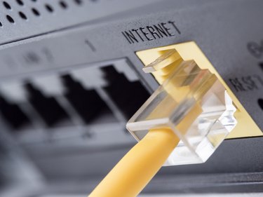 Yellow network cable connecting to the internet slot