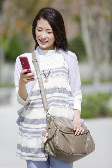 Female University Student Text Messaging