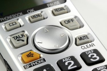 Silver cordless phone keypad closeup