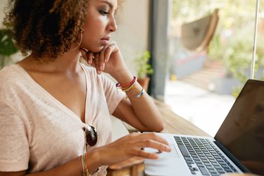 Young african woman working in coffee shop