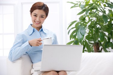 Young business lady drinking coffee