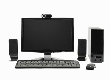 Computer with mouse, speakers and webcam