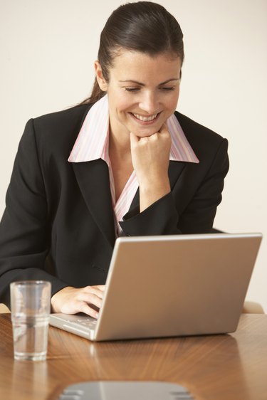 Woman working on laptop computer