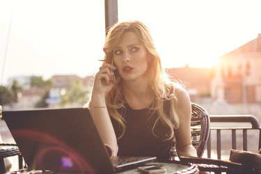 Serious business woman at sunset