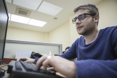 Young Man Working on PC