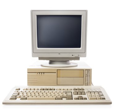 Old computer, keyboard CPU and monitor isolated on white