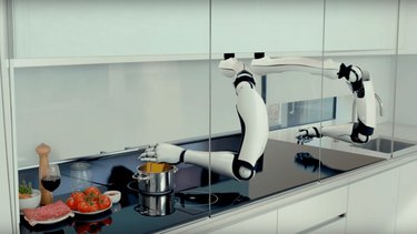 Robotic arms cook a meal