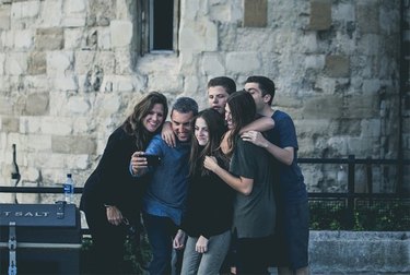Family shooting selfies in Europe