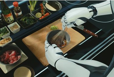 robot arms prepare a meal