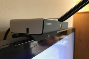 TouchJet Wave on top of a television.