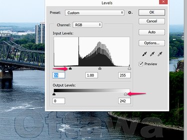A slight adjustment to the Input and Output levels fades this watermark significantly.