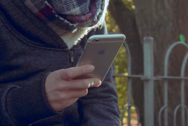 Kid looking at smartphone