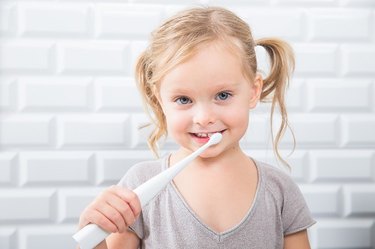 Kid using Kolibree toothbrush