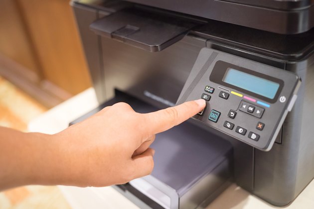Copier Start, Finger pressing the start button on multifunction printer or copier