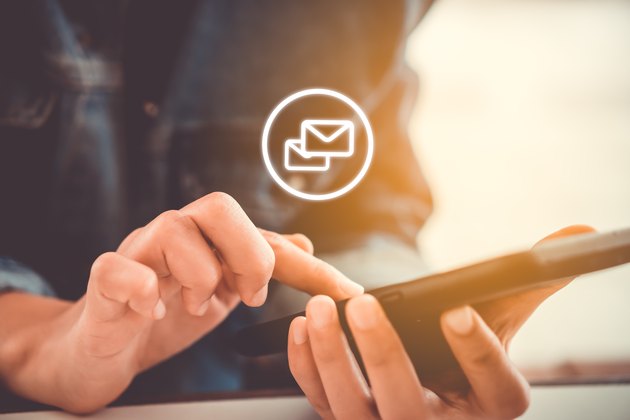 Woman hand using smartphone to send and recieve email. Business communication technology concept.