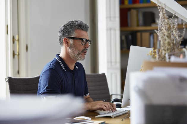Businessman using computer in office
