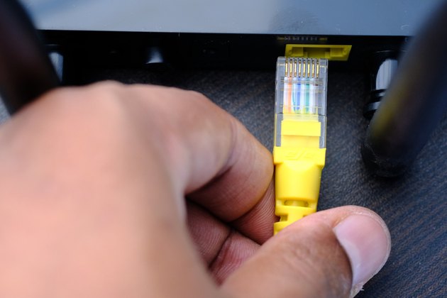 wireless router and cable on table