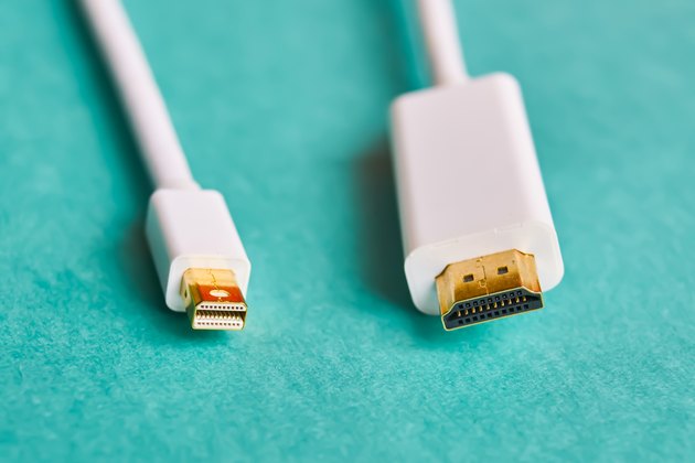 Closeup of HDMI and mini display port cables.