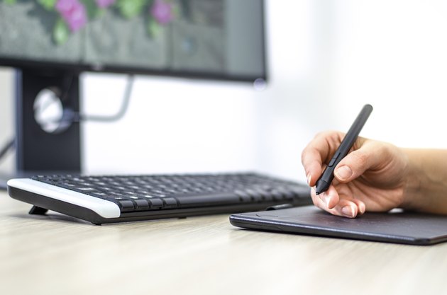 Female digital artist working at the office