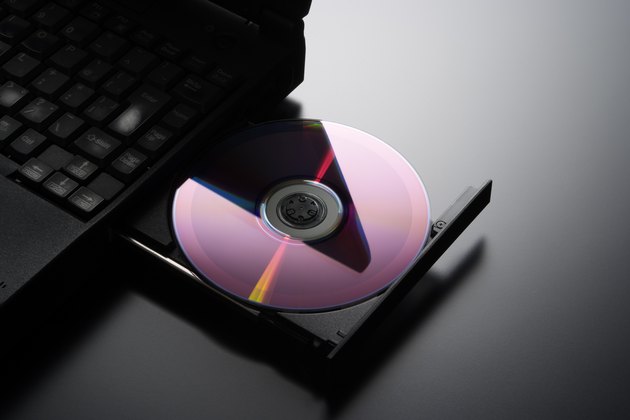 Inserting a CD into a laptop computer with copy space