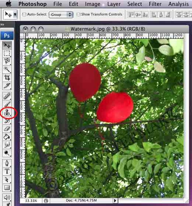 remove a watermark from a photo using photoshop