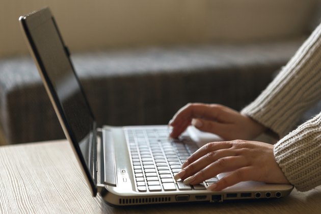 Woman hands working on keyboard