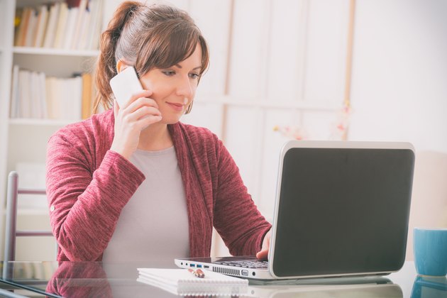 Mid age woman sitting at table