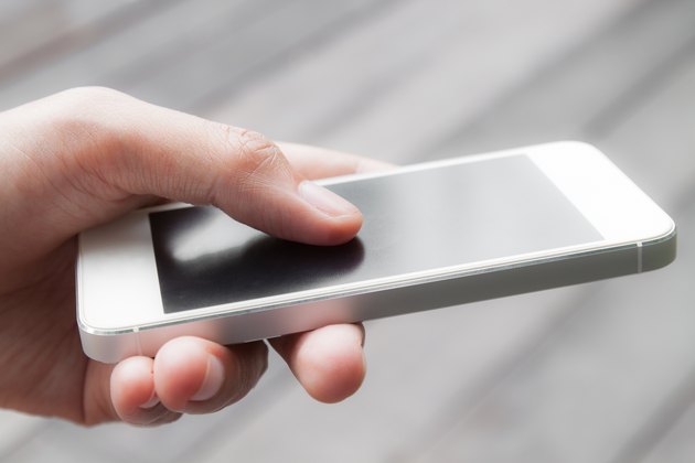 Close up of a woman using mobile smart phone