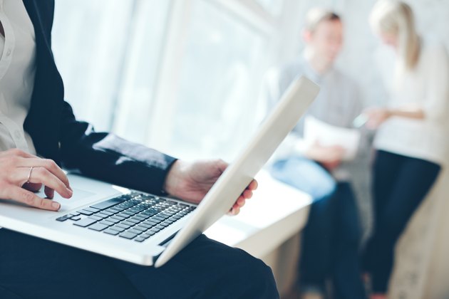 Office work process. Woman working with laptop