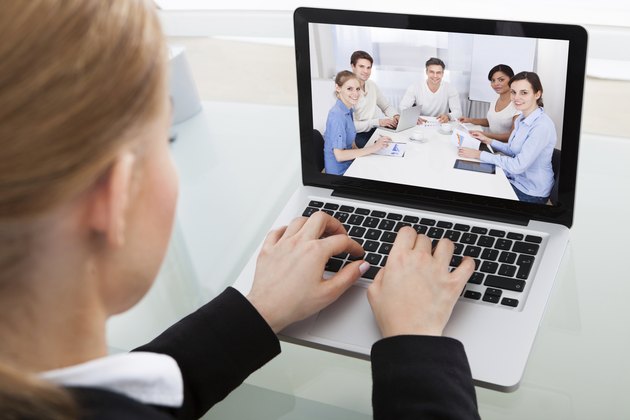 Businesswoman Chatting With Colleague