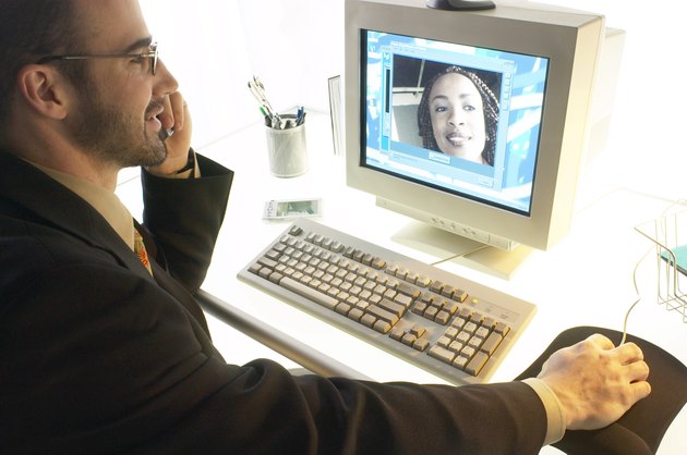 Businessman watching video conference