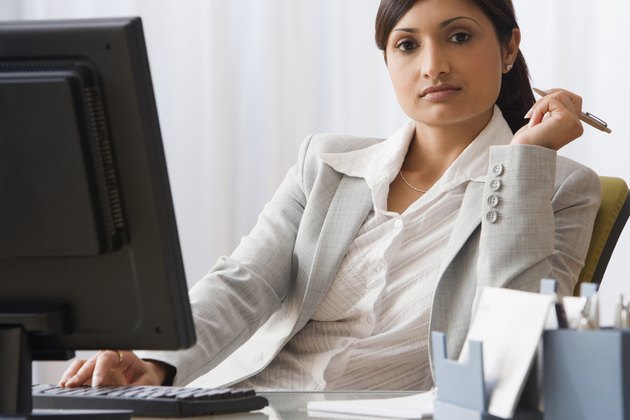 Indian businesswoman sitting at desk
