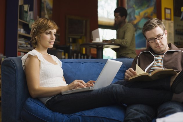 Couple reading together on couch