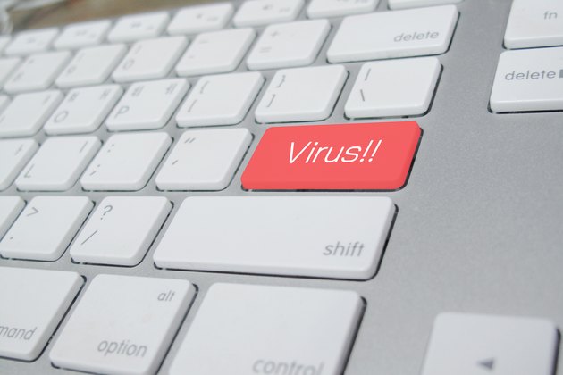 computer keyboard with word Virus