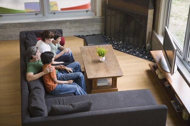 Family watching TV at home