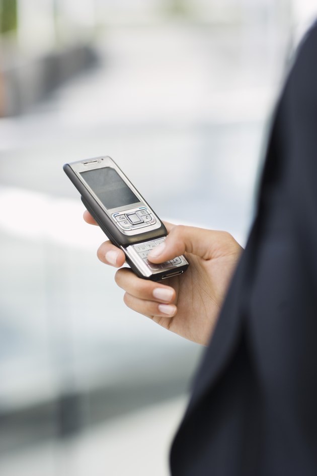 Hand holding cell phone