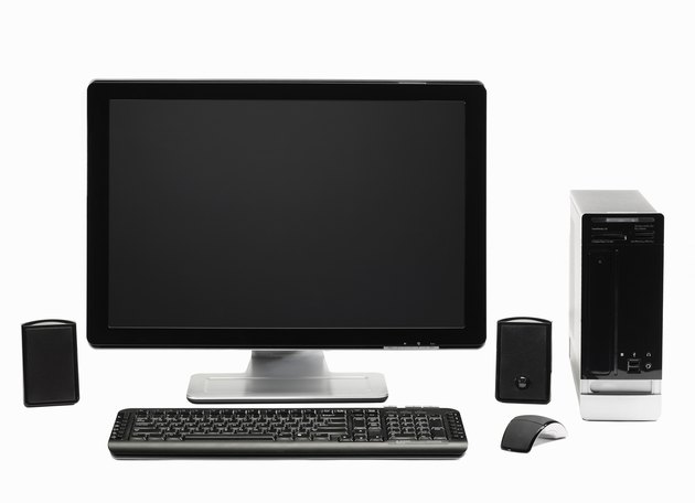 Computer with flat screen keyboard, speakers, mous