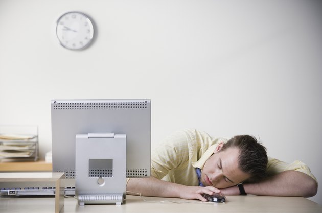 Businessman sleeping on desk