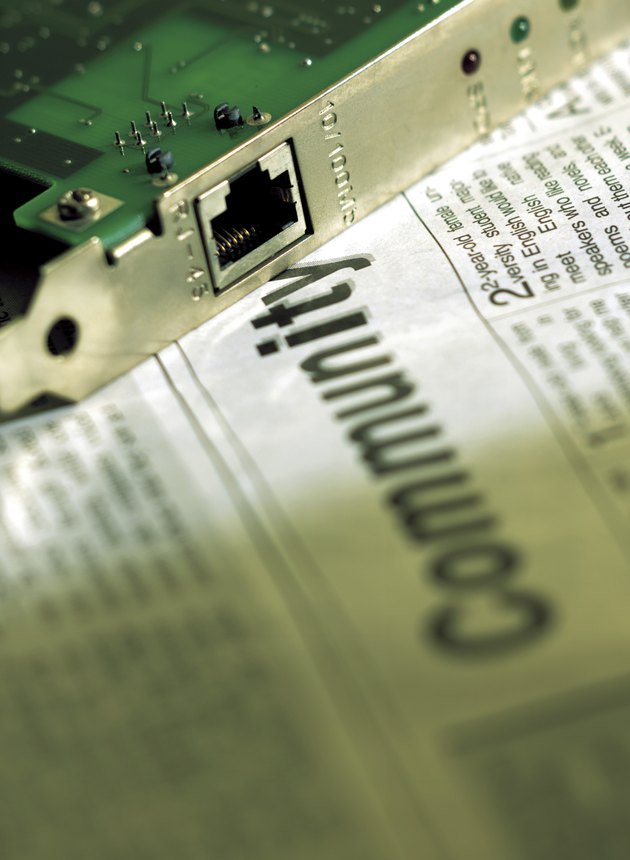 Close-up of hard drive on newspaper