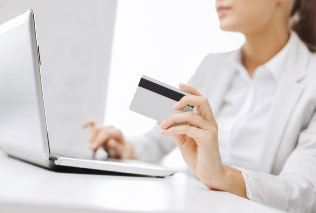 businesswoman with laptop and credit card