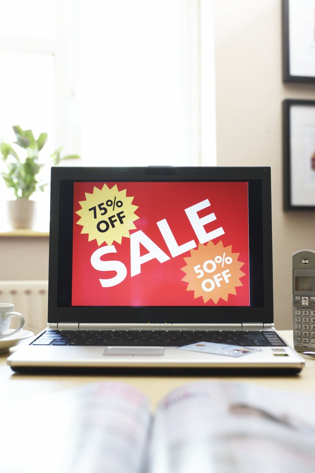 Sale advertisment on screen of laptop