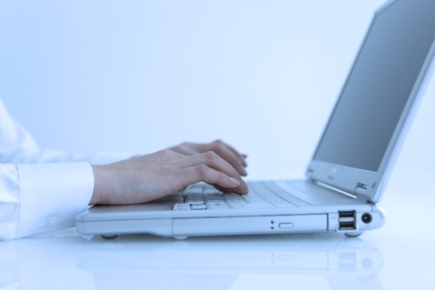 Person typing on keyboard