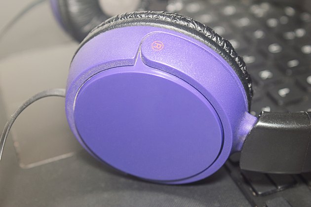 headphones on laptop keyboard