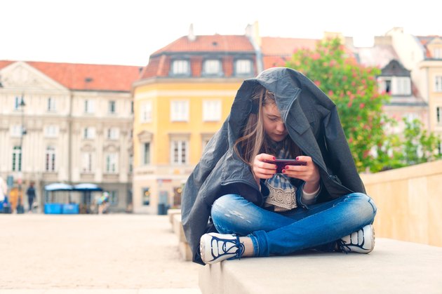 Teenage problems. Young girl addicted to social media technologies.