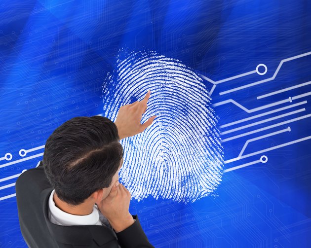 Composite image of thoughtful asian businessman pointing