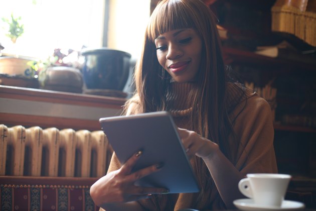 Beautiful African woman on her workplace.