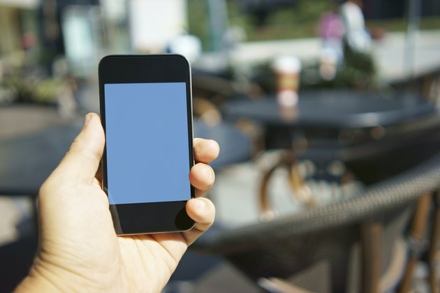 using mobile phone in a cafe