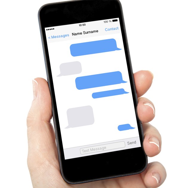 woman hand holding the phone with sms chat on screen