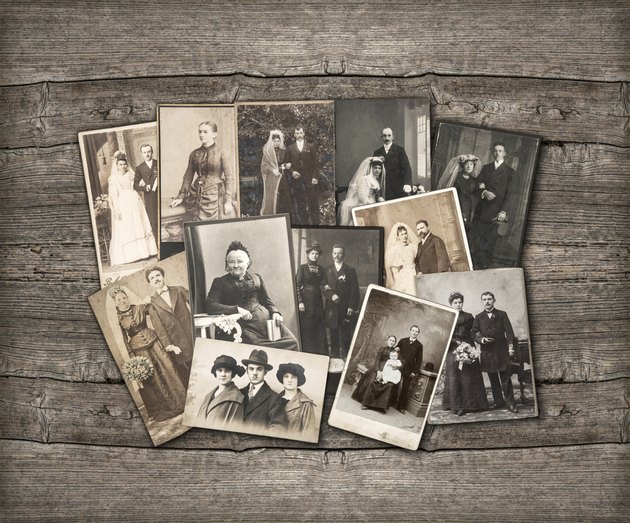 vintage family photos on wooden background